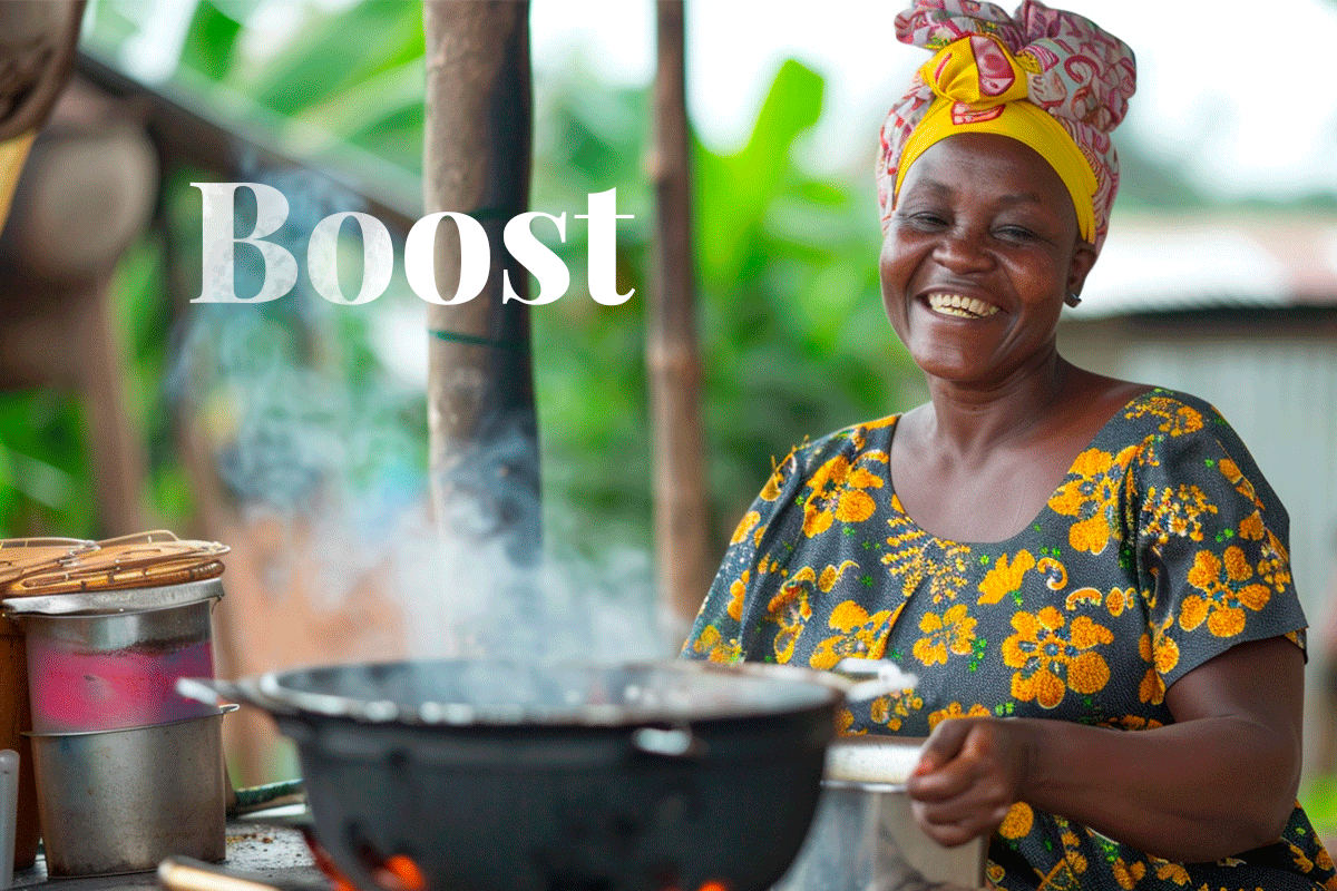 280524_Nigeria’s green energy through eco-friendly cookstoves_nigerian woman cooking in an energy efficient cookstove_news_Visual 1