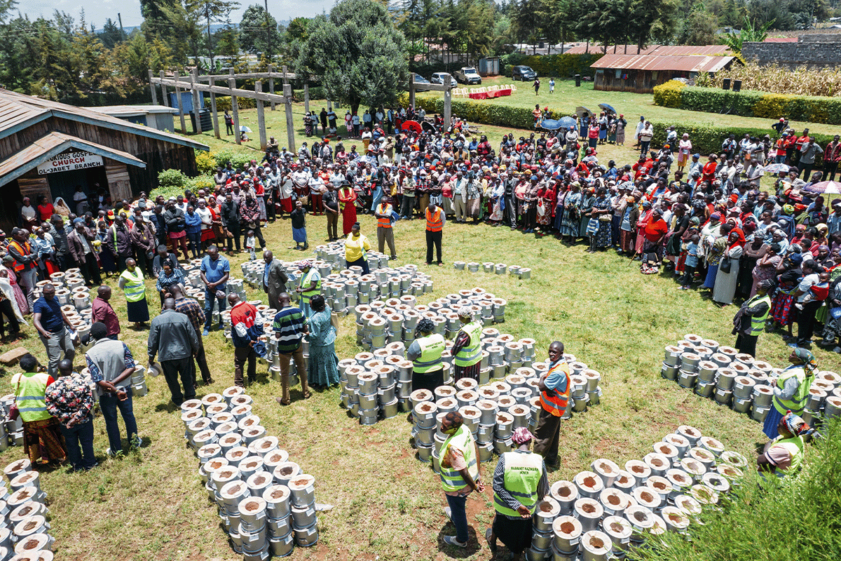 All you need to know about green bonds_ Drone picture of local people and DGB team members during cookstove distribution_visual 4