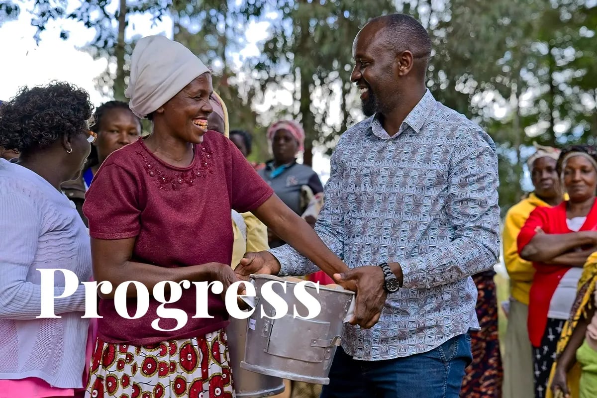 DGB Group prepares for Article 6 approval in Kenya_DGB team member and a local woman during cookstoves distribution_visual 1