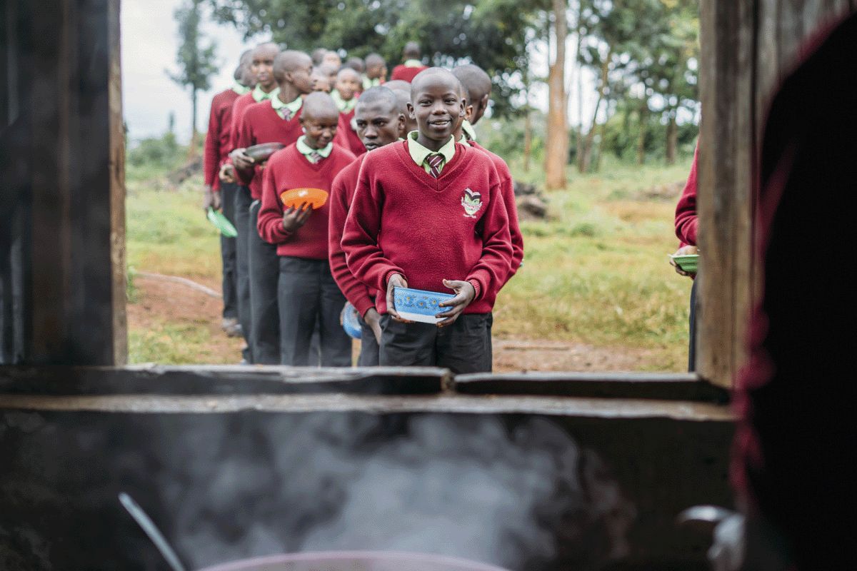 Empowering education through sustainability_View from a kitchen window on pupils waiting in line_visual 4