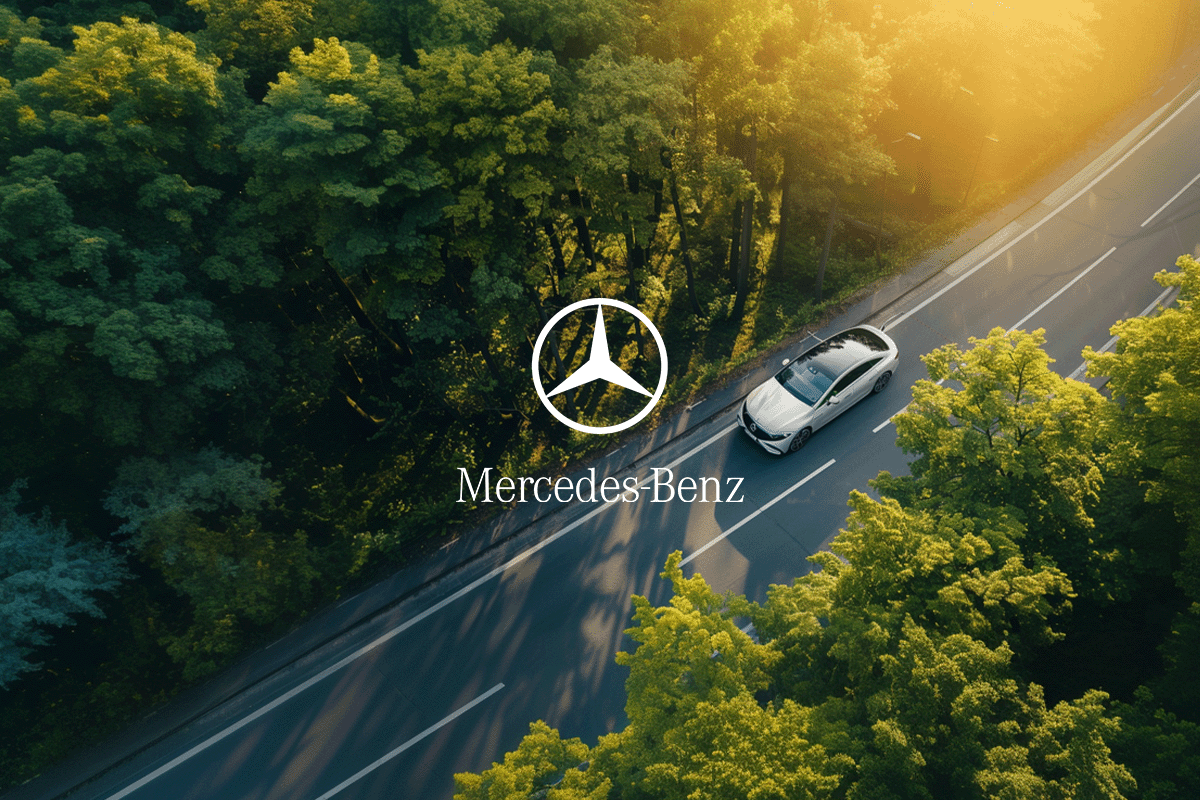 Leading German companies_ their carbon footprints and reporting practices_Aerial view of a Mercedes-Benz electric car driving down a street in a forest_visual 4