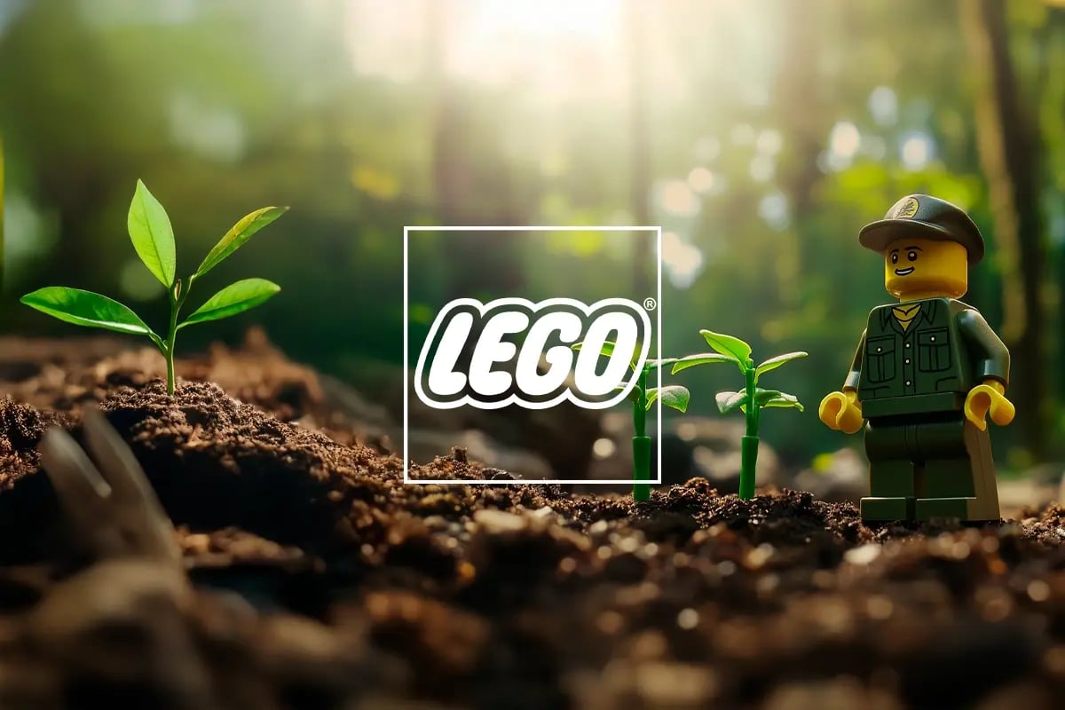 Playing for the planet, How LEGO is building a sustainable future_A Lego forester figurine stands next to tree seedlings in a forest_visual 1