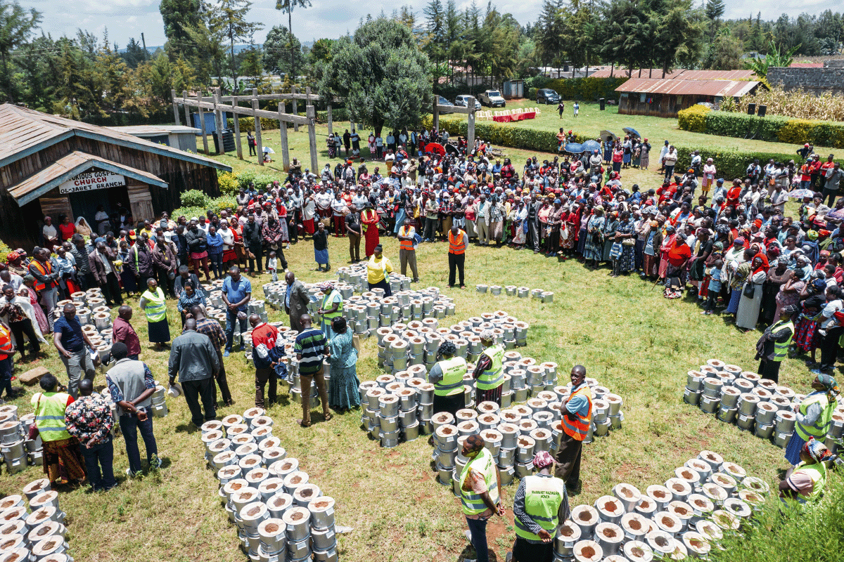 The Triple Bottom Line  balancing profit, people, and the planet_Aerial view on a local people during a cookstoves distribution_visual 4