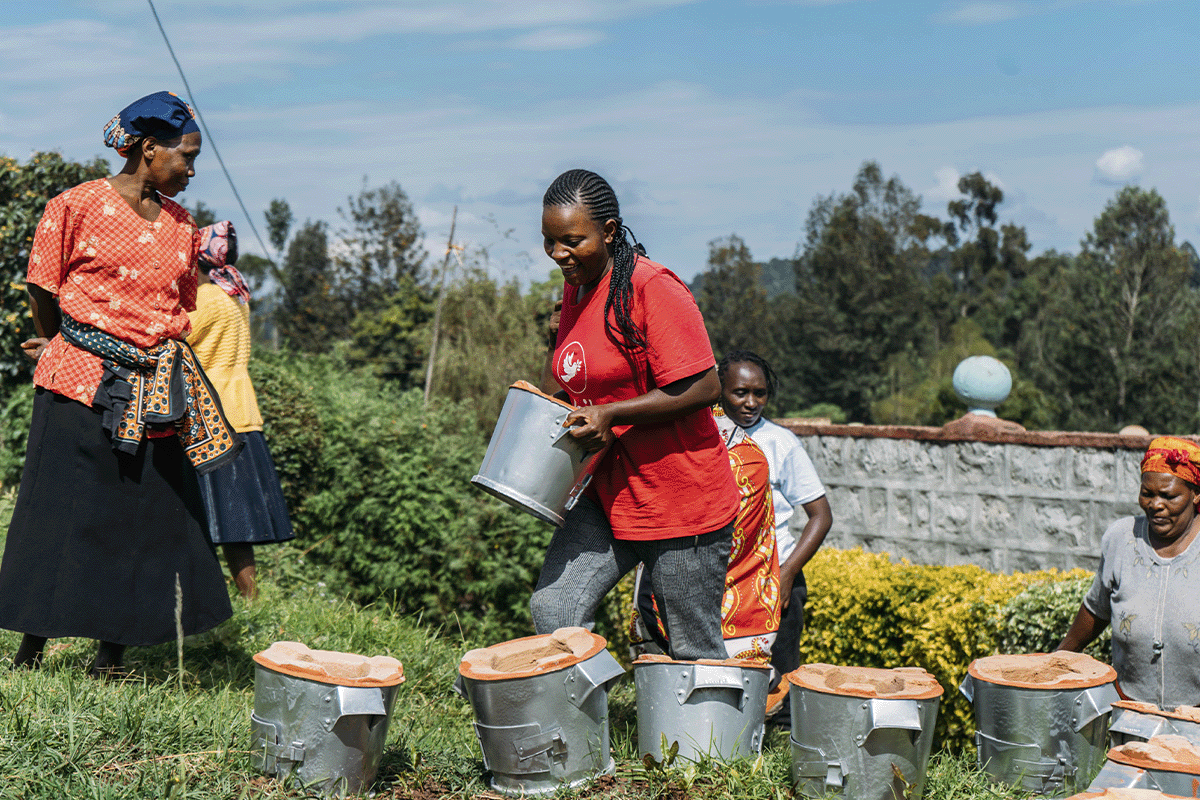 The benefits of nature-based solutions for businesses_Locals receiving new cookstoves as a part of  Hongera Energy Efficient Cookstoves Project_visual 2