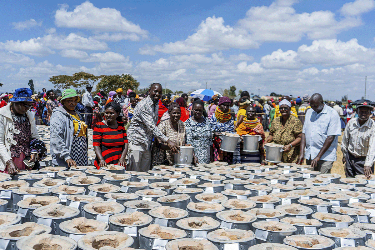 The power of high-quality carbon projects_DGB team members and local community during cookstove distribution_visual 2