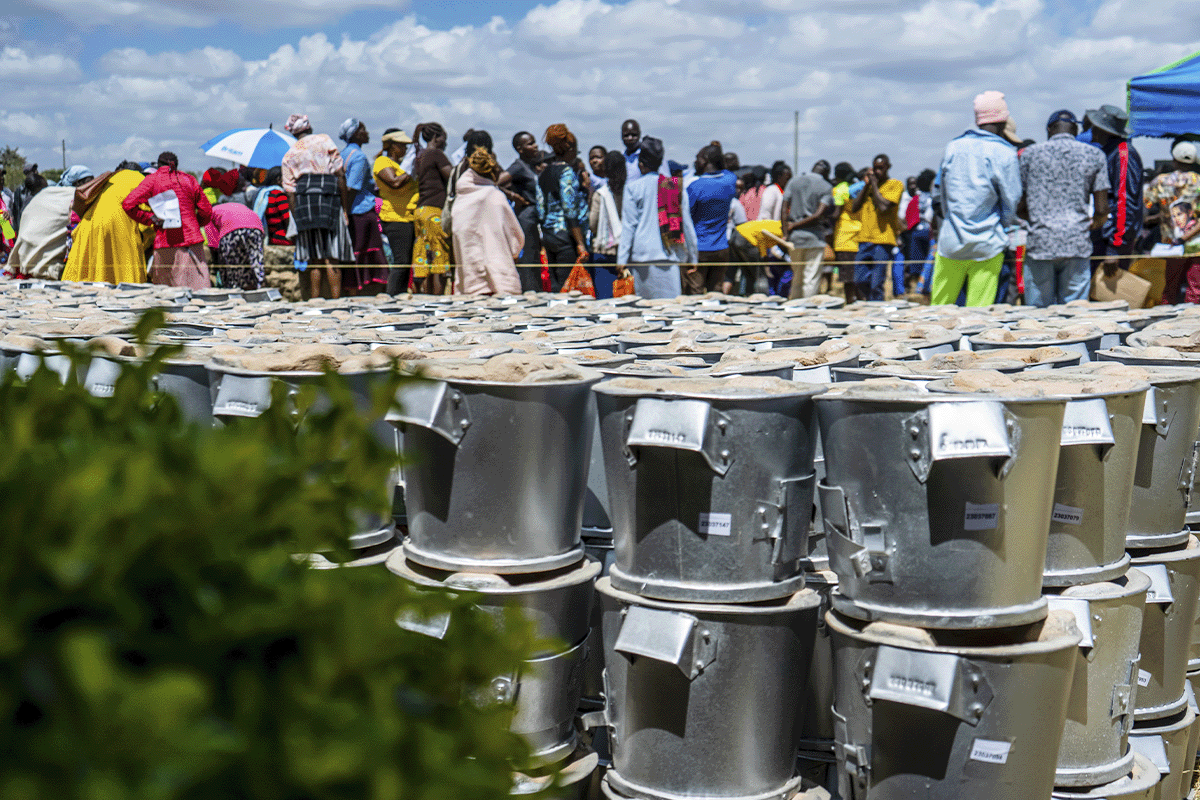 What is CSRD and how does it affect your business _Close-up of energy-efficient cookstoves, local community members in the background_visual 6